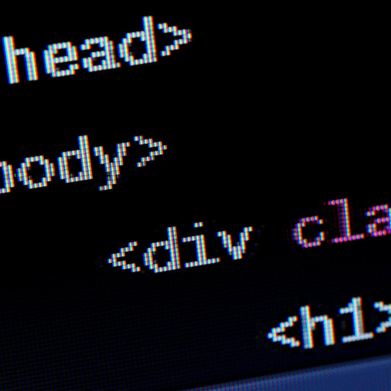Close-up of computer screen displaying HTML code, emphasizing the use of proper syntax and structure in HTML email development for web pages