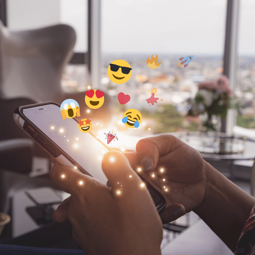 Emojis on a phone representing a user using emoticons in these emails